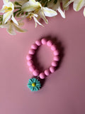 Girls Pink Beaded Bracelet with Teal Daisy Charm